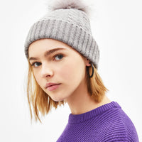 Hat with faux fur pompom