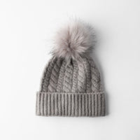 Hat with faux fur pompom